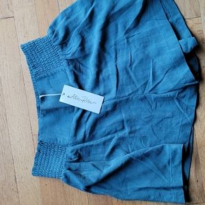 Brand new linen shorts size large  I would say like a sage green